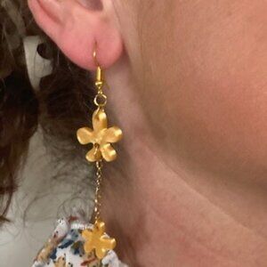 Shiny gold flowers on gold chain dangles